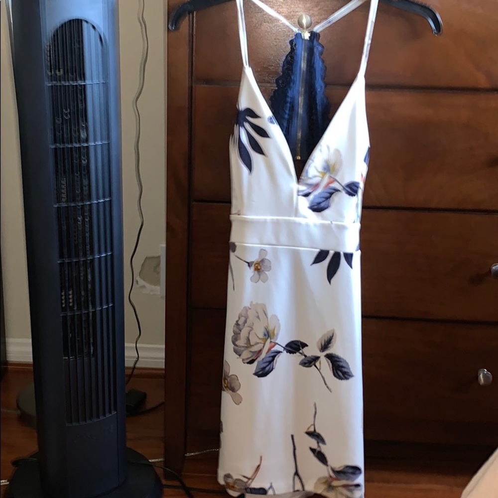 white floral dress with a blue lace open back